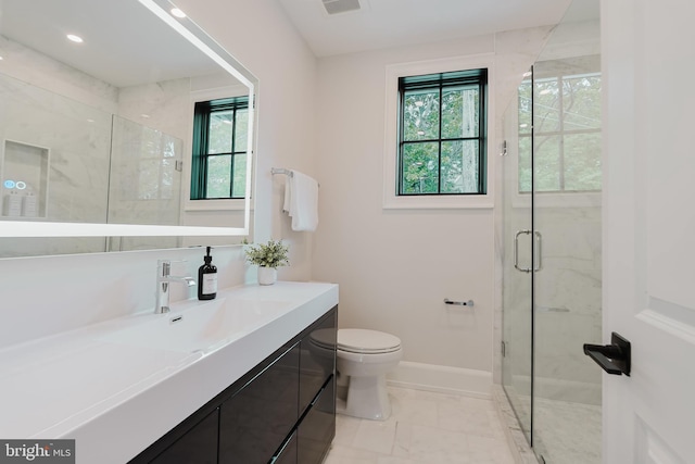 5024 Dana Pl NW, Washington, DC 20016 - bathroom with plenty of natural light, a shower stall, toilet, and baseboards