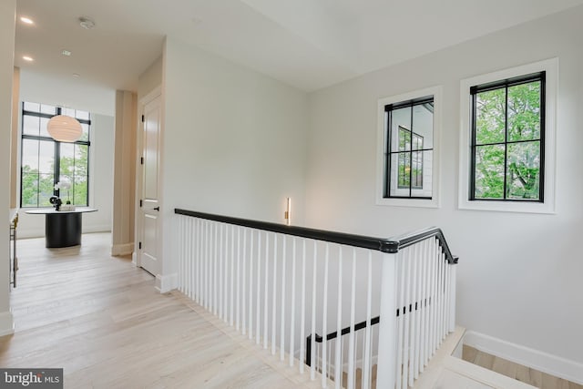 5024 Dana Pl NW, Washington, DC 20016 - corridor featuring wood finished floors, baseboards, and an upstairs landing