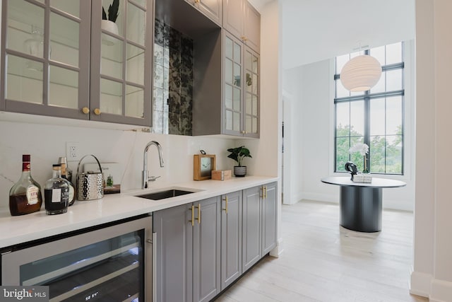 5024 Dana Pl NW, Washington, DC 20016 - indoor bar featuring beverage cooler, light wood-style floors, and baseboards