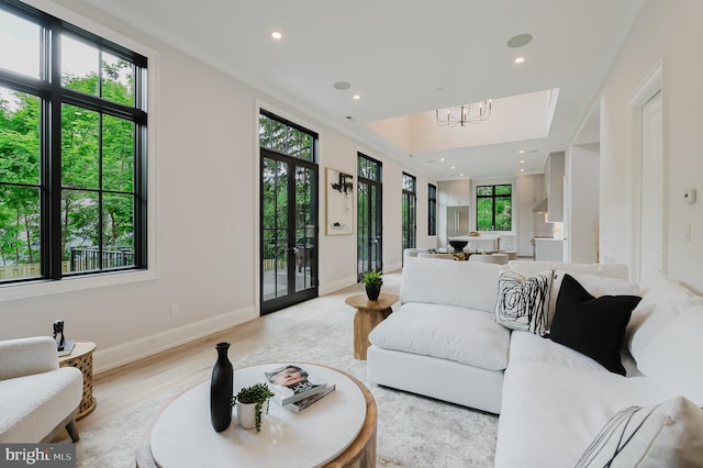 5024 Dana Pl NW, Washington, DC 20016 - living room with a chandelier, recessed lighting, baseboards, and light wood-style flooring