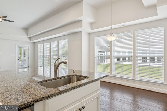 32157 Shorebreak Xing, Millville, DE 19967 - kitchen featuring a sink, white cabinets, a ceiling fan, decorative light fixtures, and dark stone countertops