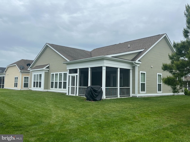 32157 Shorebreak Xing, Millville, DE 19967 - back of house with roof with shingles, a sunroom, and a yard