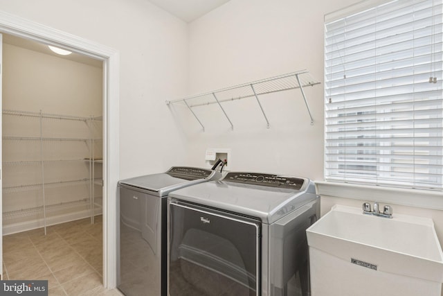 32157 Shorebreak Xing, Millville, DE 19967 - laundry room with washing machine and dryer and light tile patterned floors