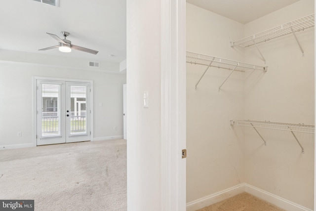 32157 Shorebreak Xing, Millville, DE 19967 - walk in closet featuring french doors, carpet, and a ceiling fan