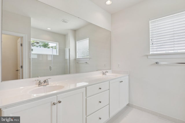 32157 Shorebreak Xing, Millville, DE 19967 - bathroom featuring double vanity, a stall shower, baseboards, tile patterned floors, and recessed lighting