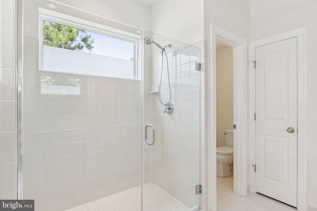 32157 Shorebreak Xing, Millville, DE 19967 - bathroom featuring toilet, a shower stall, and tile patterned floors