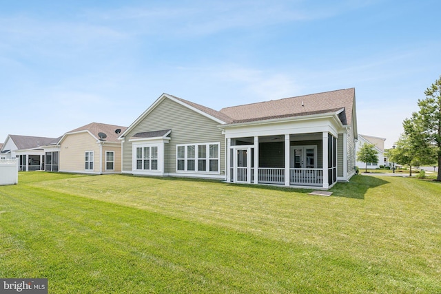 32157 Shorebreak Xing, Millville, DE 19967 - rear view of property with a sunroom, a lawn, and roof with shingles