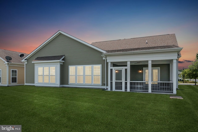32157 Shorebreak Xing, Millville, DE 19967 - rear view of house with a lawn, roof with shingles, and a sunroom