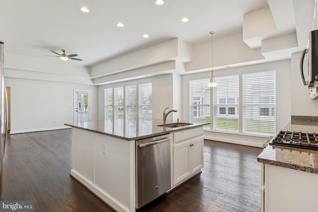 32157 Shorebreak Xing, Millville, DE 19967 - kitchen with appliances with stainless steel finishes, a sink, a ceiling fan, dark stone countertops, and recessed lighting