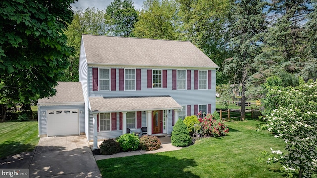 600 Trenton Rd, Langhorne, PA 19047 - colonial home with concrete driveway, an attached garage, a porch, roof with shingles, and a front lawn