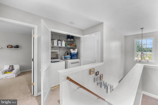 600 Trenton Rd, Langhorne, PA 19047 - hall featuring an upstairs landing, washer and dryer, light colored carpet, and baseboards