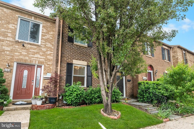 662 W Side Dr Unit 1-H, Gaithersburg, MD 20878 - townhome / multi-family property featuring a front yard and brick siding