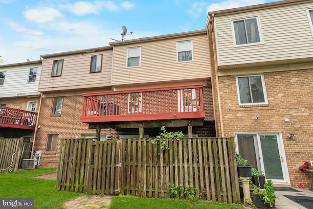 662 W Side Dr Unit 1-H, Gaithersburg, MD 20878 - back of house with central AC unit, brick siding, and fence