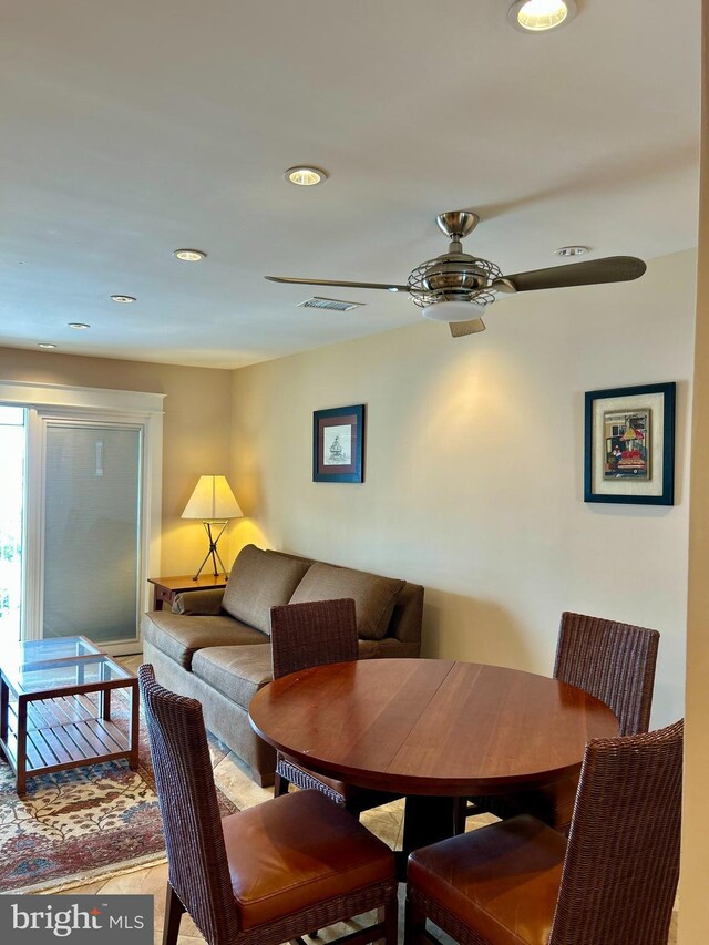dining room with a ceiling fan, wood finished floors, and recessed lighting