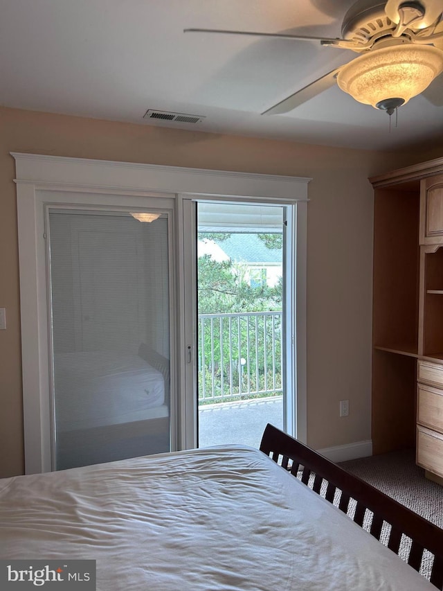 bedroom with access to outside and ceiling fan