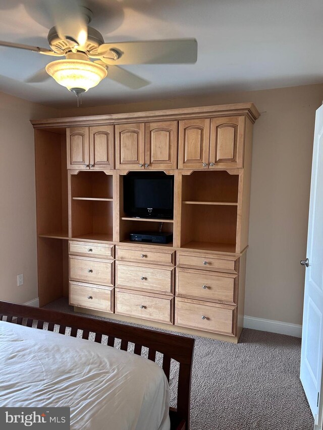 bedroom featuring carpet, baseboards, and ceiling fan