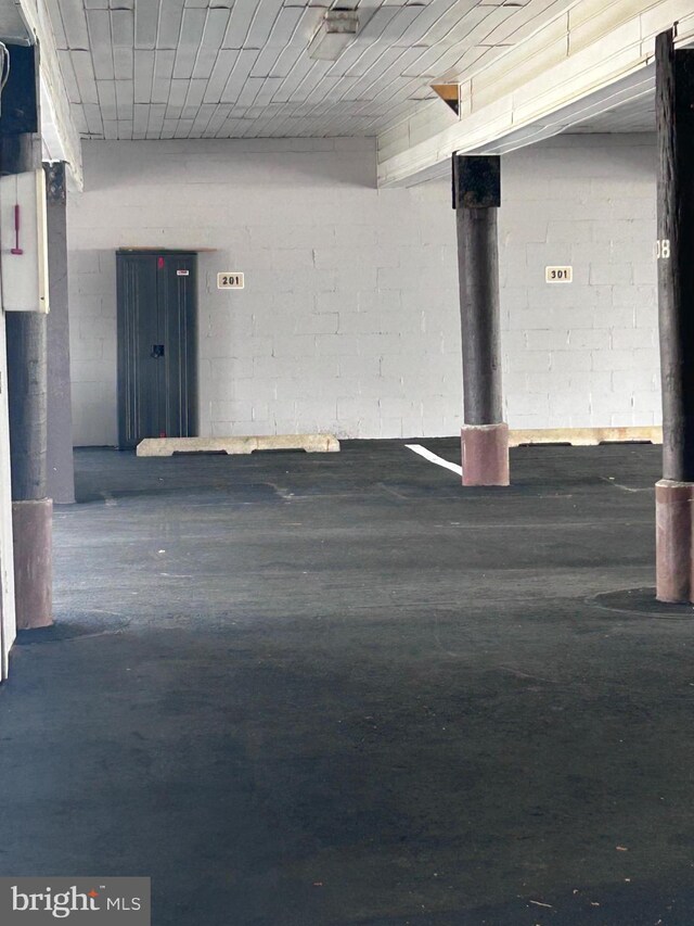 garage with concrete block wall
