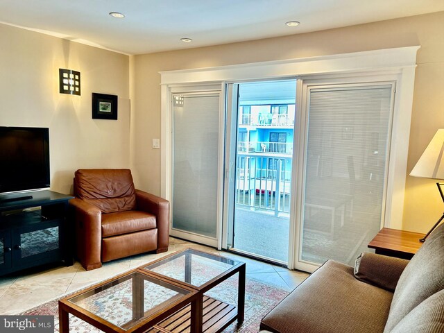 tiled living room featuring recessed lighting