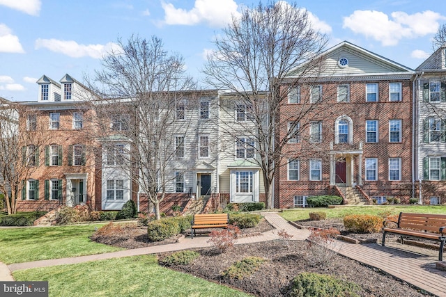 1510 Northern Neck Dr Unit 102, Vienna, VA 22182 - georgian-style home with brick siding and a front yard