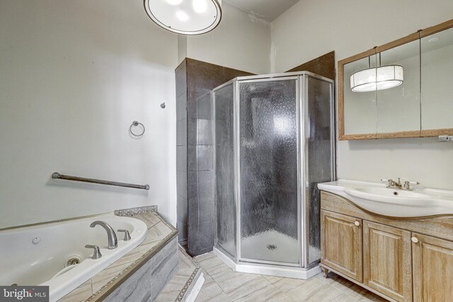 3622 Springdale Ave, Baltimore, MD 21216 - full bathroom featuring a stall shower, vanity, a whirlpool tub, and tile patterned floors