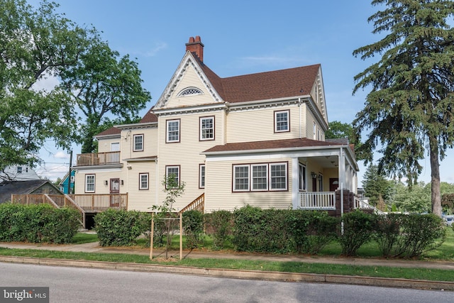 3622 Springdale Ave, Baltimore, MD 21216 - victorian house featuring a balcony and a chimney