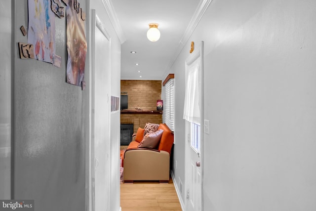 hall with wood finished floors, ornamental molding, baseboards, and recessed lighting