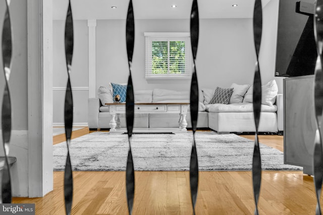 unfurnished living room featuring wood finished floors