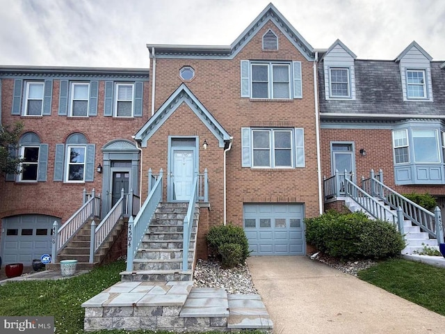 4504 Sawgrass Ct, Alexandria, VA 22312 - multi unit property with a garage, driveway, and brick siding
