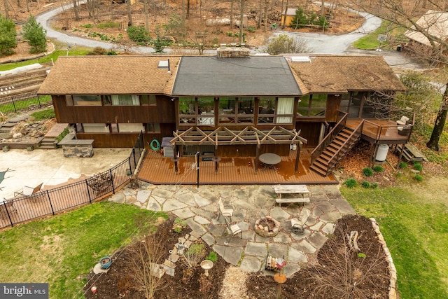 1220 Morgantown Rd, Morgantown, PA 19543 - rear view of property featuring a deck, a fenced backyard, an outdoor fire pit, a patio area, and stairs