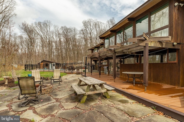 1220 Morgantown Rd, Morgantown, PA 19543 - view of patio / terrace featuring a wooden deck, an outdoor structure, a storage shed, and fence