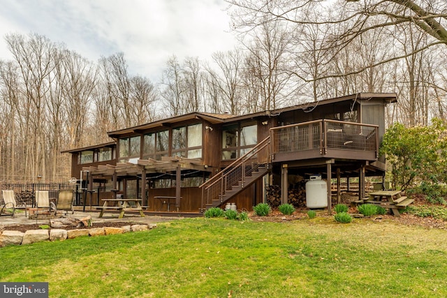 1220 Morgantown Rd, Morgantown, PA 19543 - rear view of property featuring stairs, a deck, a lawn, and a patio area