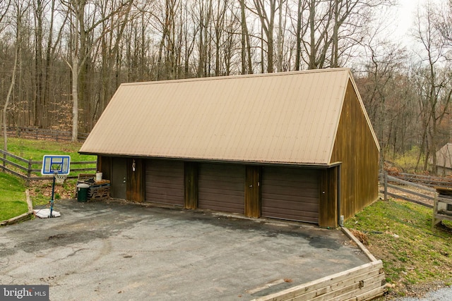1220 Morgantown Rd, Morgantown, PA 19543 - detached garage with fence and a view of trees
