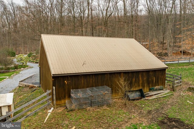 1220 Morgantown Rd, Morgantown, PA 19543 - view of outdoor structure featuring fence, an outbuilding, and a wooded view
