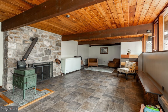 1220 Morgantown Rd, Morgantown, PA 19543 - living area with a wood stove, wood ceiling, beamed ceiling, and stone finish floors