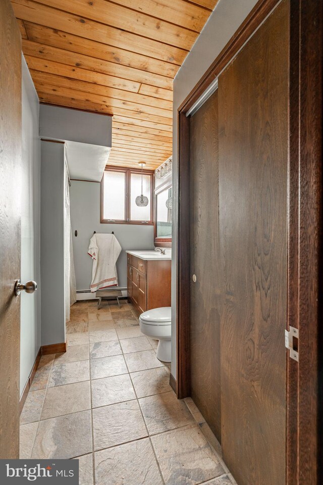 1220 Morgantown Rd, Morgantown, PA 19543 - bathroom featuring wood ceiling, vanity, toilet, and baseboards