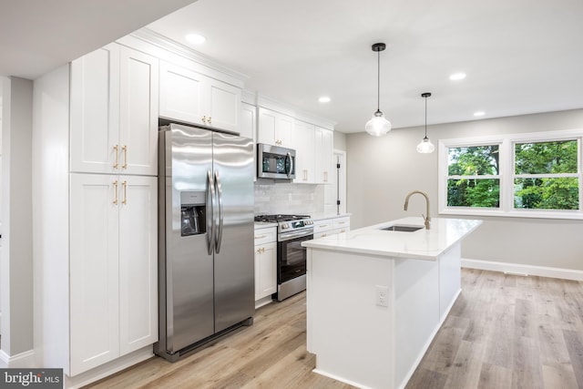1985 W Blvd, Malaga, NJ 08328 - kitchen with stainless steel appliances, a sink, light wood-style floors, white cabinetry, and tasteful backsplash