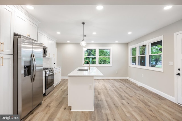 1985 W Blvd, Malaga, NJ 08328 - kitchen with appliances with stainless steel finishes, a sink, baseboards, white cabinets, and light countertops