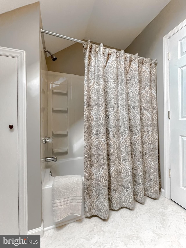 full bathroom featuring shower / tub combo with curtain