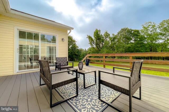 wooden deck featuring an outdoor hangout area