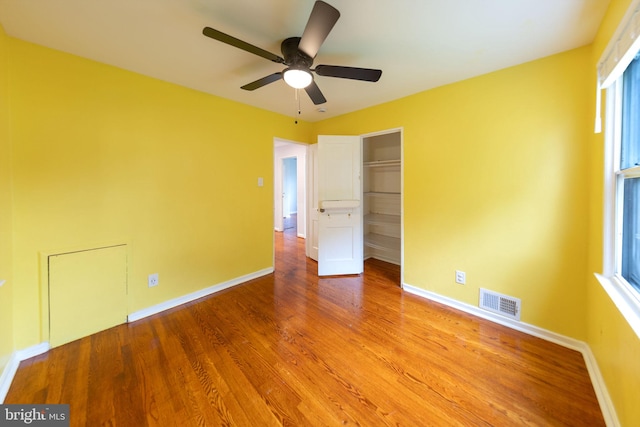 3321 Clay St, Silver Spring, MD 20902 - unfurnished bedroom with wood finished floors, baseboards, a closet, and a ceiling fan
