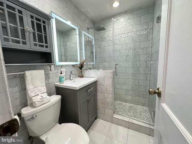 3321 Clay St, Silver Spring, MD 20902 - bathroom featuring a shower stall, toilet, vanity, and tile walls