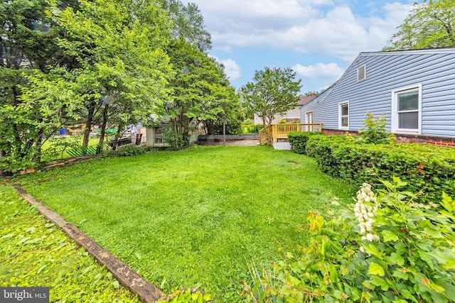 3321 Clay St, Silver Spring, MD 20902 - view of green lawn with a wooden deck