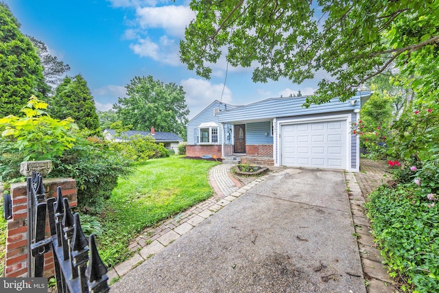 3321 Clay St, Silver Spring, MD 20902 - view of front of home featuring an attached garage, concrete driveway, a front yard, and brick siding