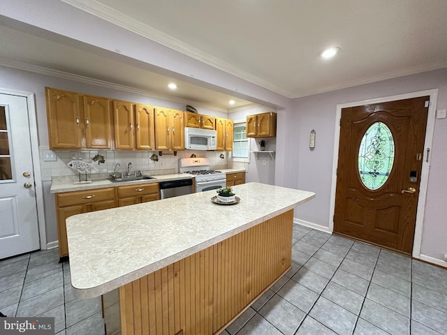 3321 Clay St, Silver Spring, MD 20902 - kitchen with white appliances, a sink, light countertops, decorative backsplash, and crown molding