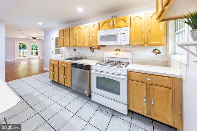 3321 Clay St, Silver Spring, MD 20902 - kitchen featuring white appliances, a sink, light tile patterned flooring, ornamental molding, and tasteful backsplash