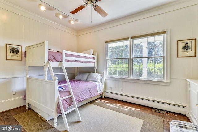 6437 Blantyre, Warrenton, VA 20187 - bedroom with a baseboard heating unit, wood finished floors, track lighting, and a decorative wall