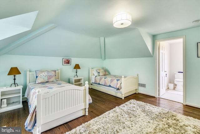 6437 Blantyre, Warrenton, VA 20187 - bedroom featuring wood finished floors, ensuite bath, vaulted ceiling, and baseboards
