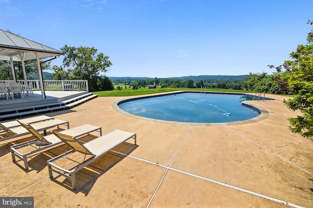 6437 Blantyre, Warrenton, VA 20187 - swimming pool featuring a deck, a gazebo, and a patio area
