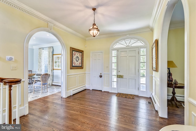 6437 Blantyre, Warrenton, VA 20187 - foyer entrance featuring arched walkways, a decorative wall, a baseboard heating unit, ornamental molding, and plenty of natural light
