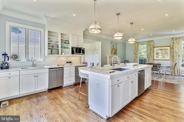 6437 Blantyre, Warrenton, VA 20187 - kitchen featuring appliances with stainless steel finishes, a sink, open shelves, white cabinetry, and crown molding